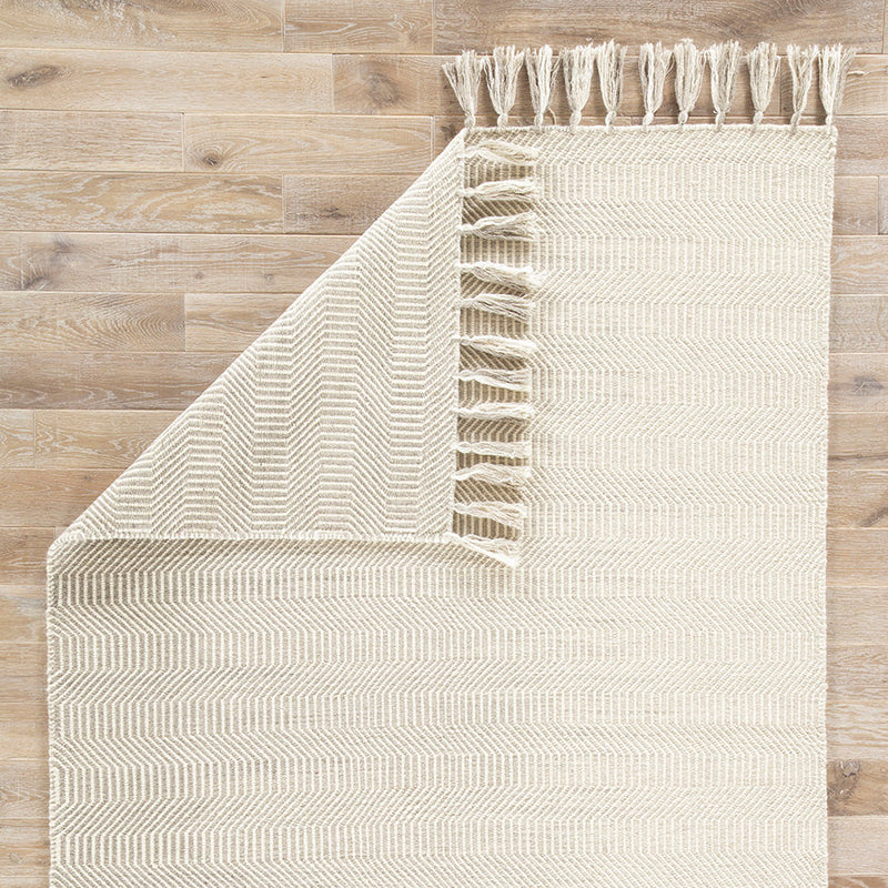 Close-up of wool tassels on a handmade rug