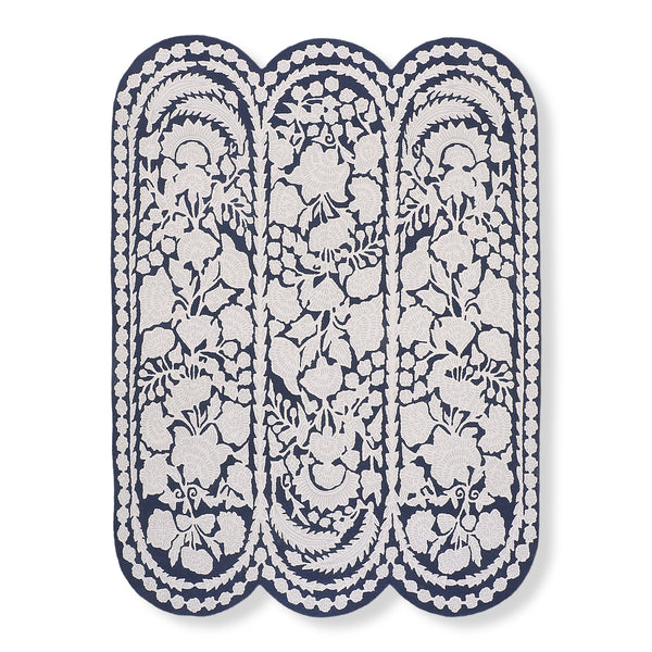 Chinoiserie wool tufted rug in navy and ivory with a scalloped three-lobe shape and floral pattern