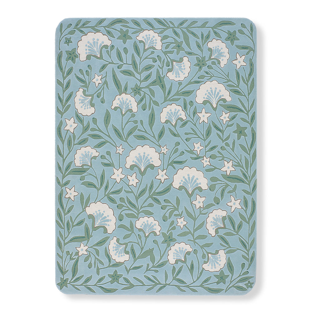 Garden hand-tufted wool rug in soft blue with sage green trailing vines and cream floral blossoms