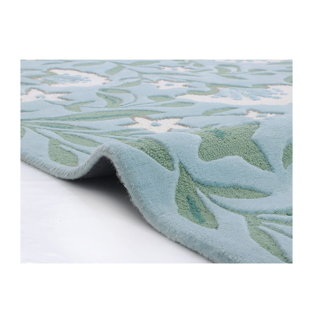 Corner of the Garden rug folded back to show the plush half-inch wool pile