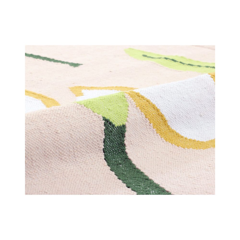 Close-up of the hand-drawn pink, yellow, and white blooms on the Petaline recycled rug